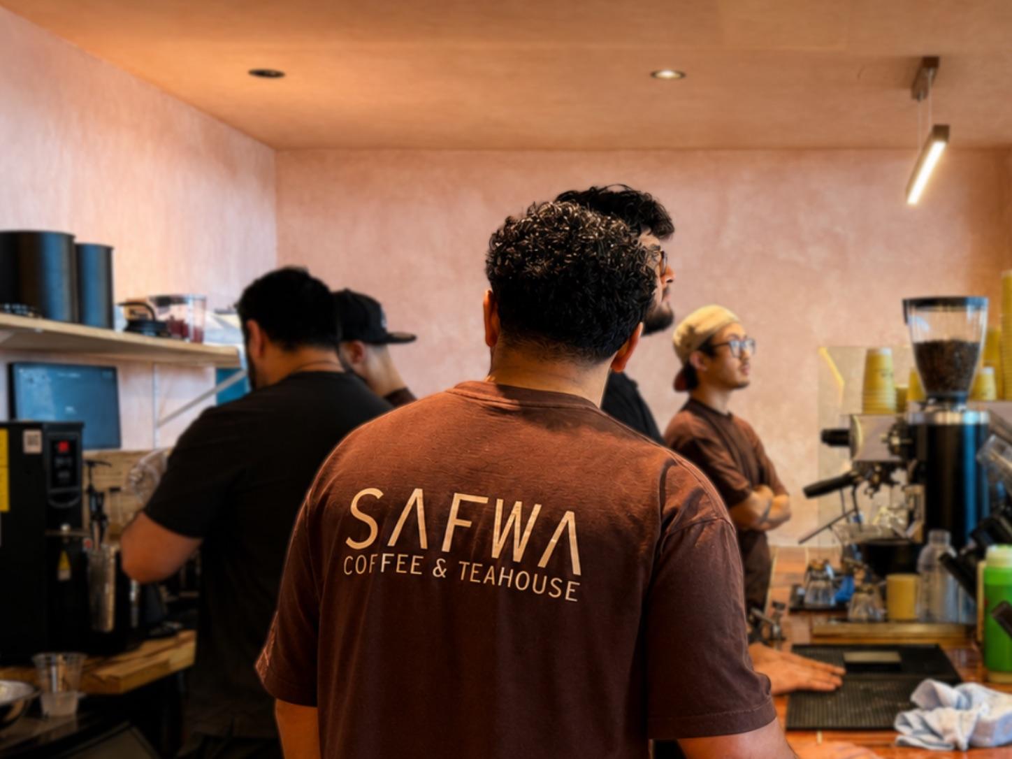 Safwa baristas pulling drinks behind the bar in Westbury, New York