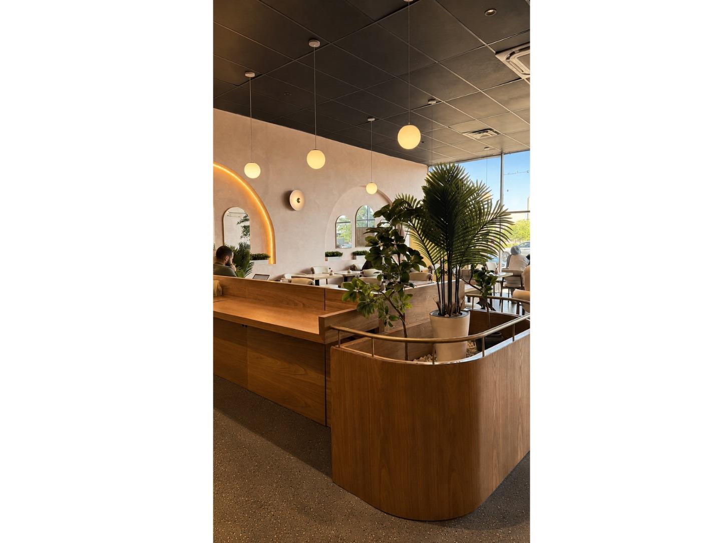 The counter and arched, golden-lit interior of Safwa Westbury